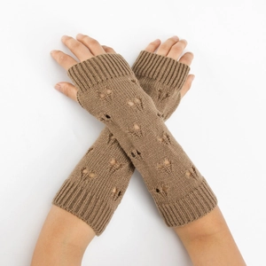Detail of brown knitted arm warmers with hollow patterns and thumb hole design