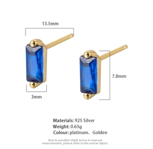 Macro detail of S925 sterling silver rectangular earrings with deep blue cubic zirconia