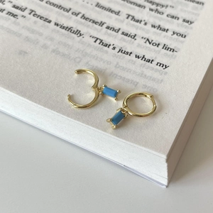 925 sterling silver gold hoop earrings with turquoise rectangular pendant on book