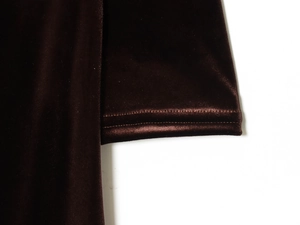 Close-up of ruched velvet midi dress showing stitching detail and soft fabric texture
