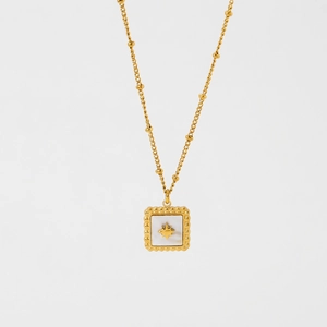 Detail of 13mm gold plated starburst pendant with white shell inlay and 38+5cm chain