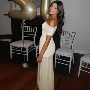 Detail showing off-shoulder ruching and mesh fabric on a cream-white midi dress