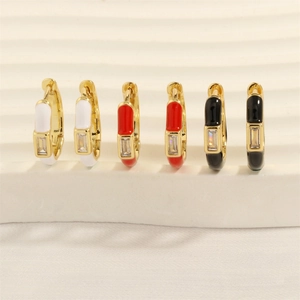Detail of colorful enamel gold hoop earrings with vertical rectangle zircon stone