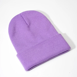 Detailed texture of purple knit beanie with wide ribbed cuff and soft acrylic fibers