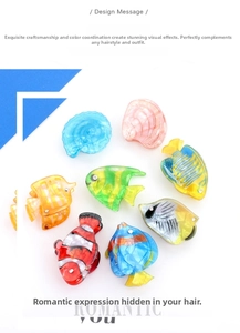 Detail of colorful acrylic ocean theme hair clips with tropical fish and shell designs