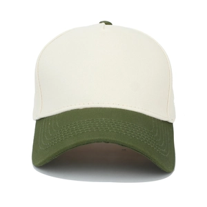 Close-up of contrast color cotton twill baseball cap with cream crown and green visor