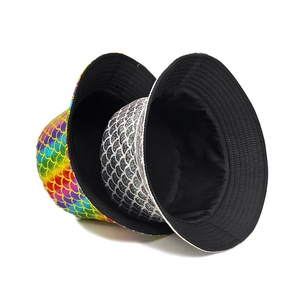 Reversible bucket hat with colorful metallic fish scale texture and black lining