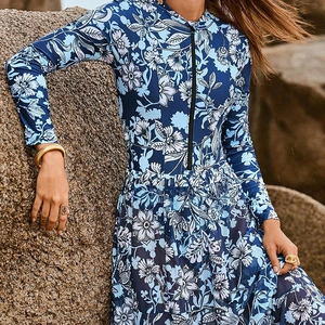 Blue floral long sleeve zip-up swimsuit set with matching beach skirt for women