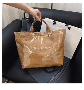Close-up of waterproof Tyvek tote bag featuring crinkled texture and transparent PVC layer