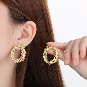 Elegant 18k gold plated stainless steel leaf wreath hoop earrings for women on model