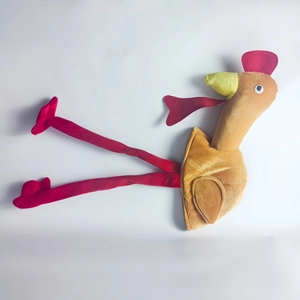 Detailed view of plush turkey hat with long red legs and soft yellow fabric for Thanksgiving