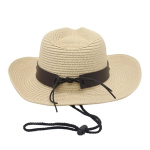 Detail of beige straw cowboy hat featuring brown leather band and adjustable chin strap