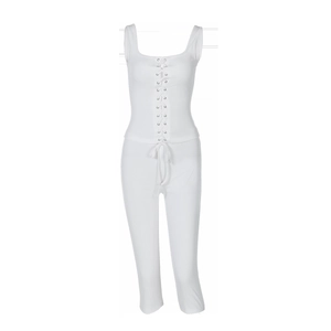 Detail of white ribbed knit two-piece set featuring front lace-up top and slim-fit pants