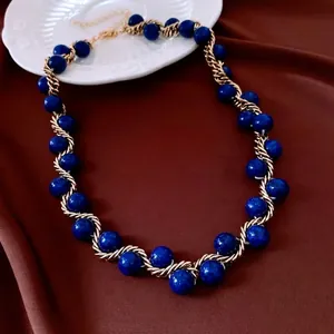 Vintage gold metal chain twisted stone necklace with blue beads and elegant gold wire wrap