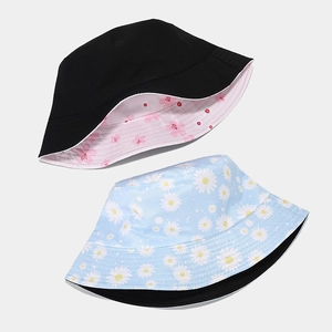 Reversible floral fisherman hat with daisy and cherry blossom patterns for sun protection