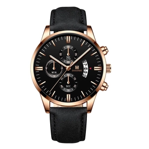 Detailed macro view of the rose gold bezel and black leather strap of this quartz watch