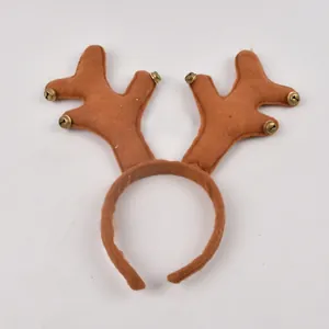 Detailed view of brown felt reindeer antler headband with festive golden bells