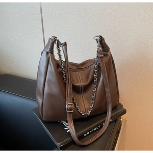 Brown leather Hobo bag featuring white contrast stitching and a silver chain detail