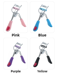 Detail view of portable stainless steel eyelash curlers with combs and heart-shaped grips