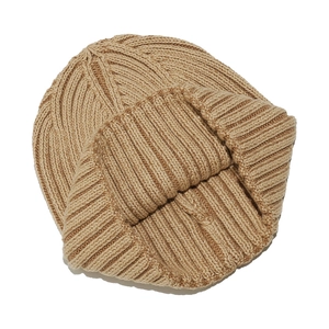 Detailed view of the thick ribbed knit texture on a warm camel winter beanie hat