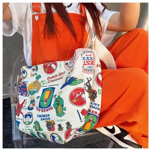 Detail shot of vintage collage print on durable canvas tote bag worn by a model