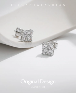 Macro shot of 925 sterling silver square moissanite earrings on ceramic edge