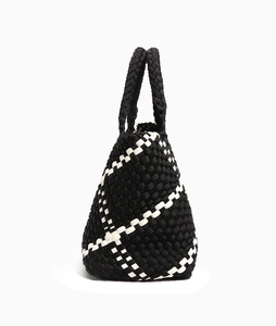 Close-up of black and white woven texture and sturdy handle on this stylish tote bag
