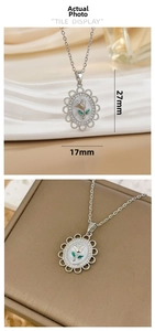 Detail view of oval rose pendant necklace showing dimensions 27mm height and 17mm width