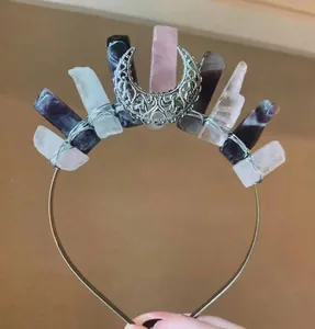 Detailed view of handmade moon crown with natural quartz crystals and silver wire wrap