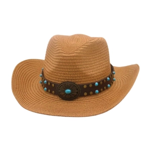 Detail of straw cowboy hat featuring turquoise beads and vintage metal floral buckle