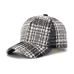 Detail shot of the textured black and white plaid wool blend fabric on a baseball cap