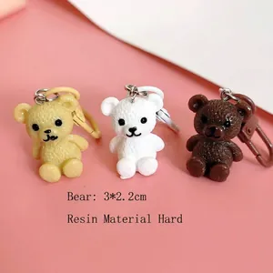 Resin cartoon bear keychains in three colors sized 3x2.2cm for bags and car keys