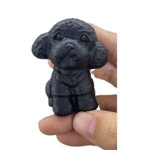 Handcrafted matte black obsidian puppy figurine showing detailed dog carving craft