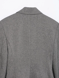 Detail view of the gray herringbone blazer back showing collar and shoulder stitching