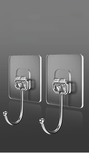 Close-up of clear adhesive wall hooks featuring durable PVC base and stainless steel hook