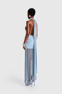 Detail of light blue backless halter dress with long fringe hem and sparkling texture