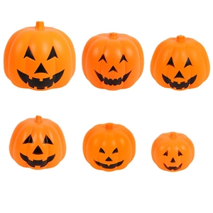 Set of six orange Halloween jack-o-lanterns with black faces on a white background