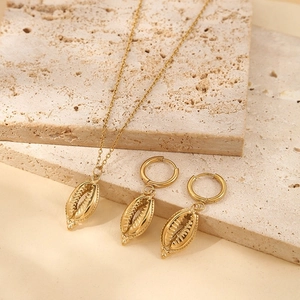 Bohemian gold seashell jewelry set including fine chain necklace and matching hoop earrings