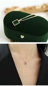 Detailed view of square emerald and ruby pendant necklaces on 14K gold plated chains