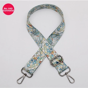 Close-up of colorful ethnic patterned bag strap with adjustable gunmetal hardware