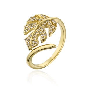 Macro detail of leaf-shaped open ring in gold with pave cubic zirconia accents
