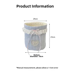 Quilted blue fabric storage basket with lace trim and bow detailing, size 29x23x18cm