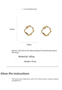 Macro view showing ruched stripe texture and 925 silver needle on gold twisted earrings