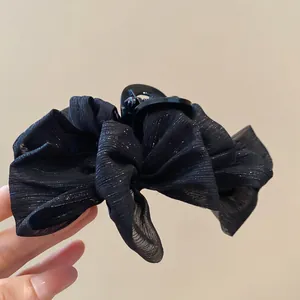 Elegant black mesh bow hair claw clip with shimmering silver glitter and resin teeth