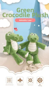 Detailed view of plush green crocodile dolls with soft fabric texture and striped belly