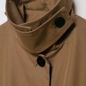British style khaki trench coat featuring a high neck collar with windproof buckle detail