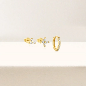 Detailed macro shot of S925 sterling silver gold earrings with marquise cubic zirconia