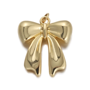 Detailed close-up of a polished gold bow pendant for DIY necklaces and earrings