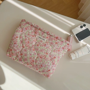 Quilted floral cotton makeup bag with pink flowers and a woven simple wish label tag