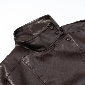 Detailed view of dark brown PU leather jacket featuring a stand collar and metallic snap button